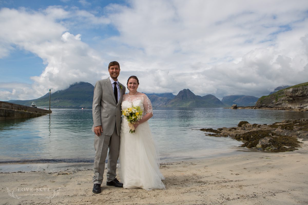 Bride and groom on sandy beach Elgol, Isle of Skye