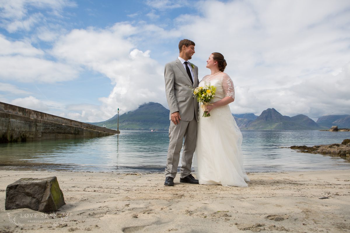 Bride and groom on sandy beach Elgol, Isle of Skye