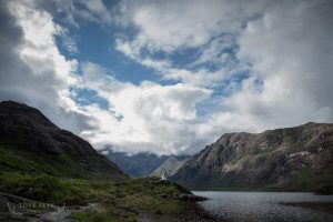 Wide view of Loch Coruisk with very small wedding couple in centre of image
