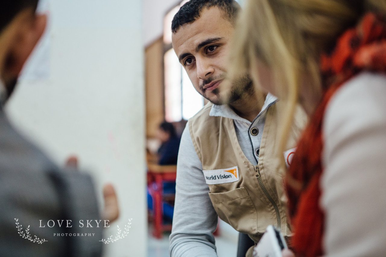 World Vision project teacher remedial school in Jordan for Syrian refugees with two female journalists Iribid north of Amman