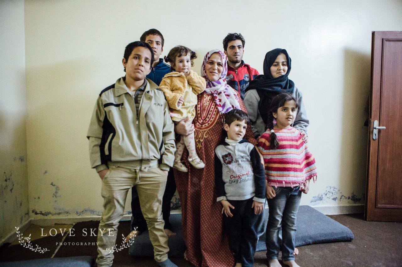 Syrian refugee family group in basement apartment northern Jordan