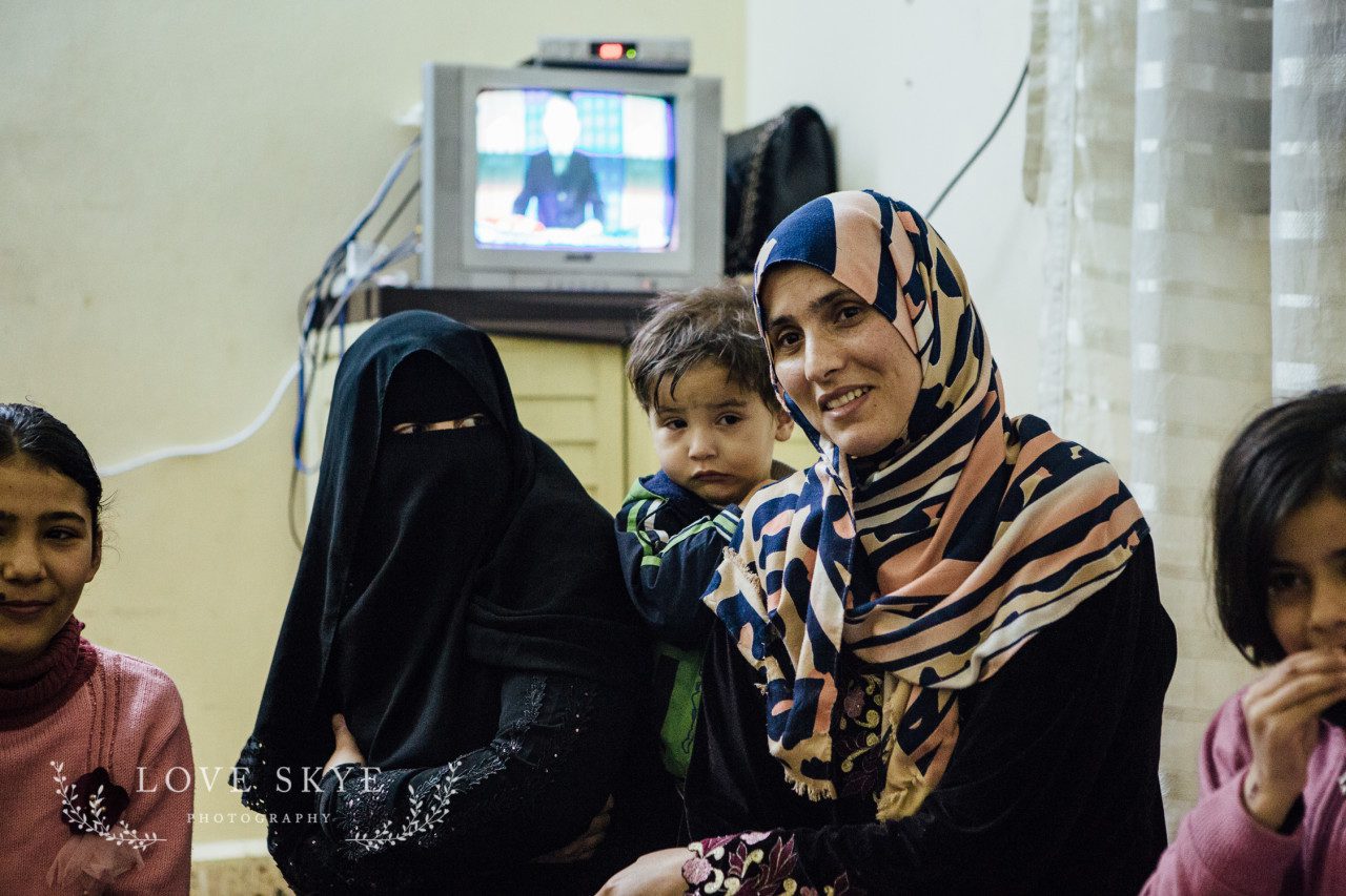 Syrian refugee mothers and their children gather for tea in Jordan