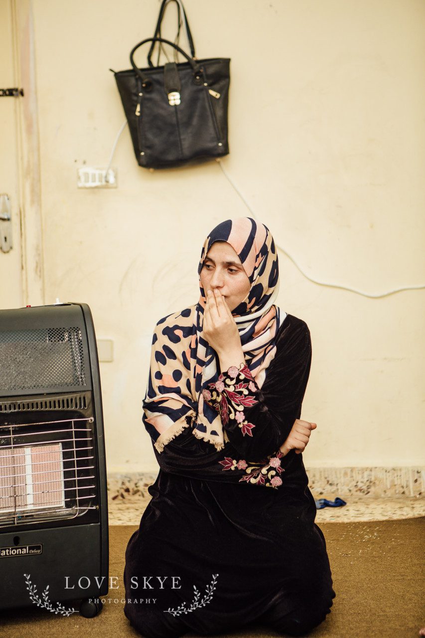 Female refugee pictured with sole possessions Jordan