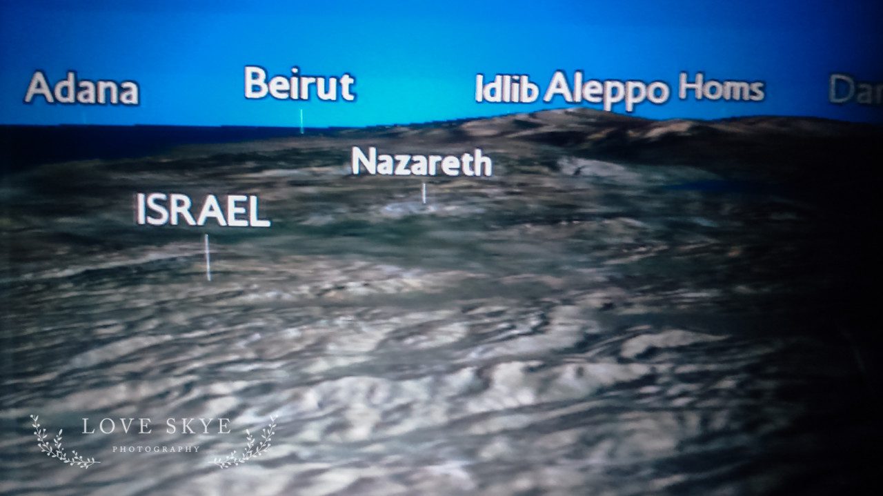 airline seatback screen of Israel, Jordan and Syria showing locations of Aleppo , Homs, Nazareth and Beirutjordan, syria, refugee, world vision, barefootcoatless