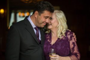 bride and groom drink champagne after wedding ceremony at Torridon Hotel