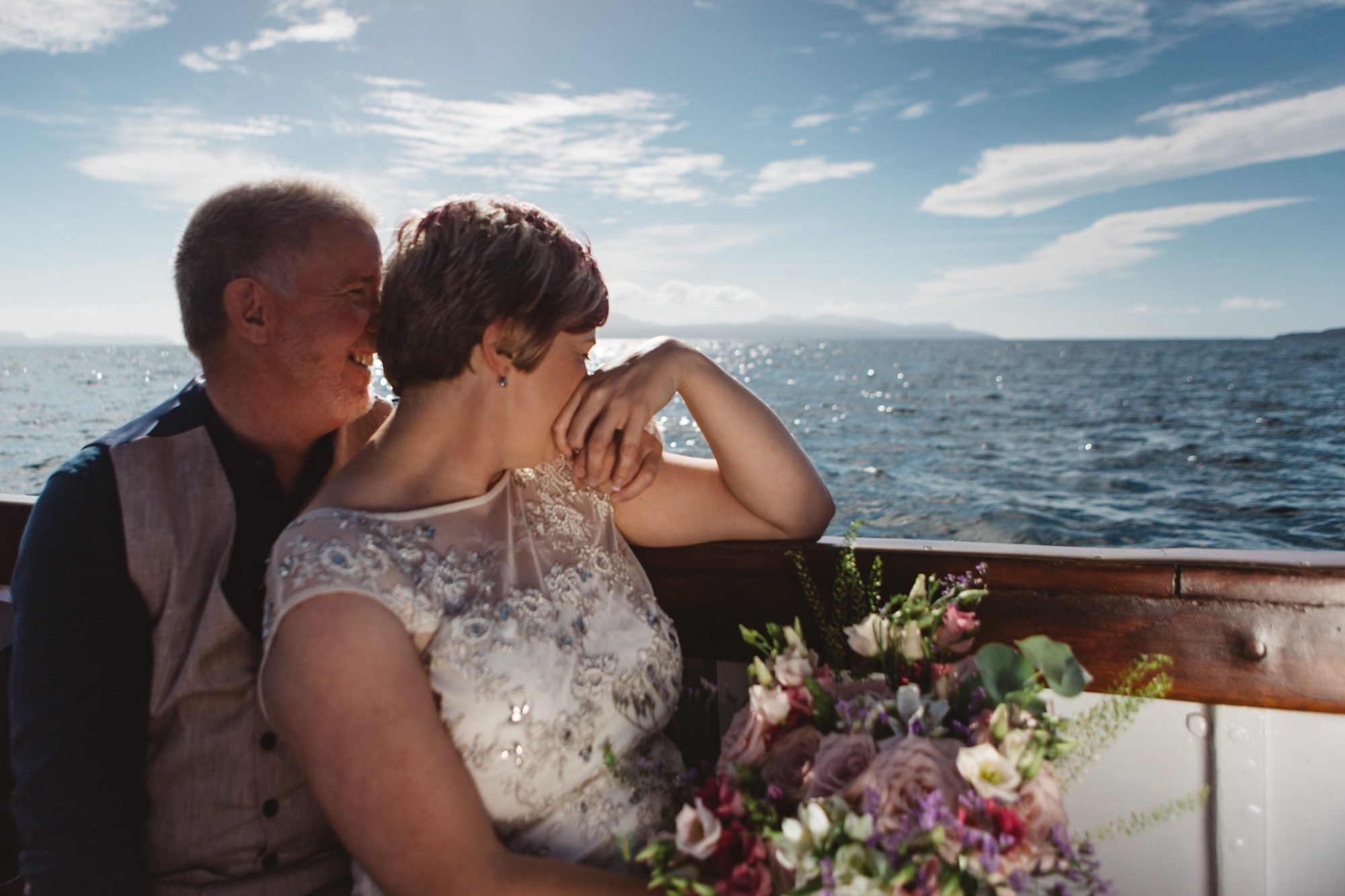 Bride and groom at sea aboard Misty Isle boat