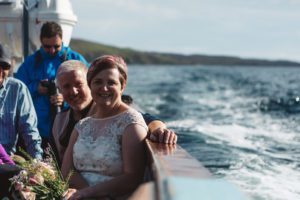 Bride and groom at sea aboard Misty Isle boat