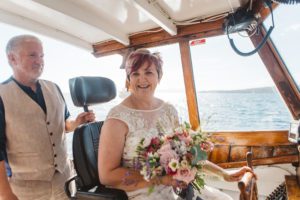 Bride drives boat Misty Isle