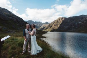 Bride and groom exchange vows during wedding ceremony loch coruisk