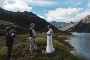Bride and groom exchange vows during wedding ceremony loch coruisk