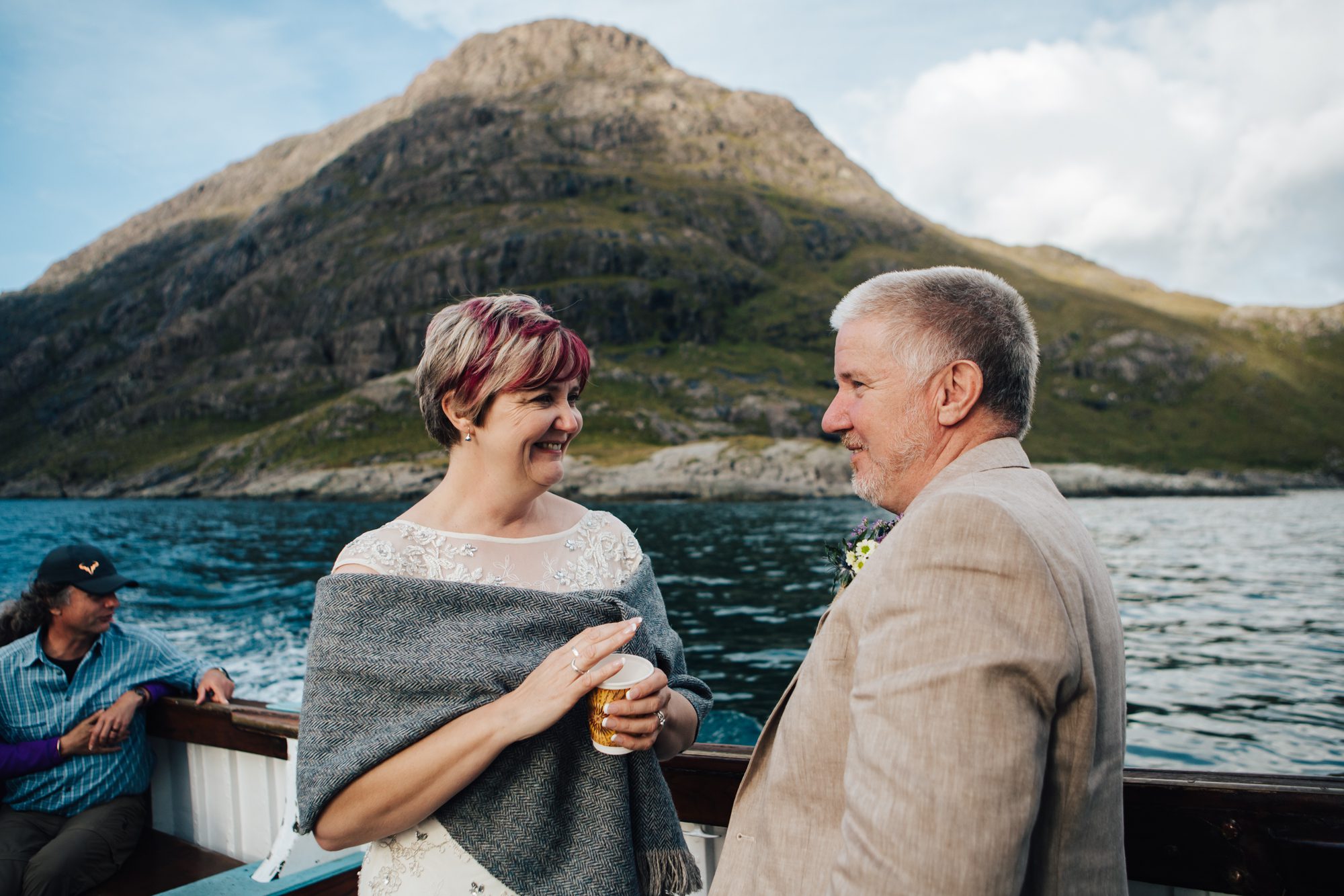 Bride and Groom chatting aboard Misty Isle boat , Sgurr na Stri behind