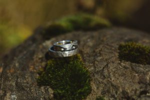 handmade wedding rings on moss