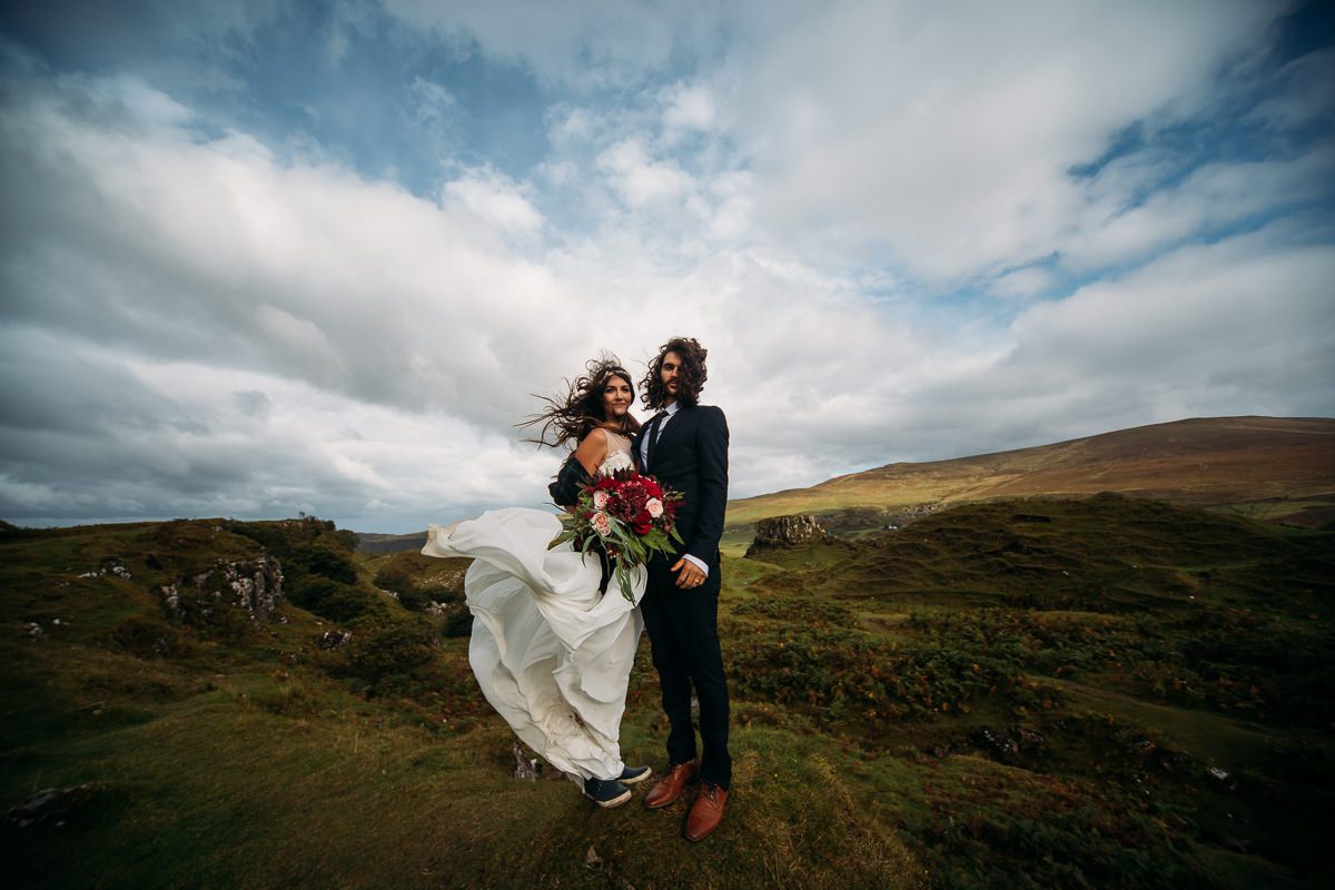 Bride and groom with bracken and sky Fairy Glen Isle of Skye