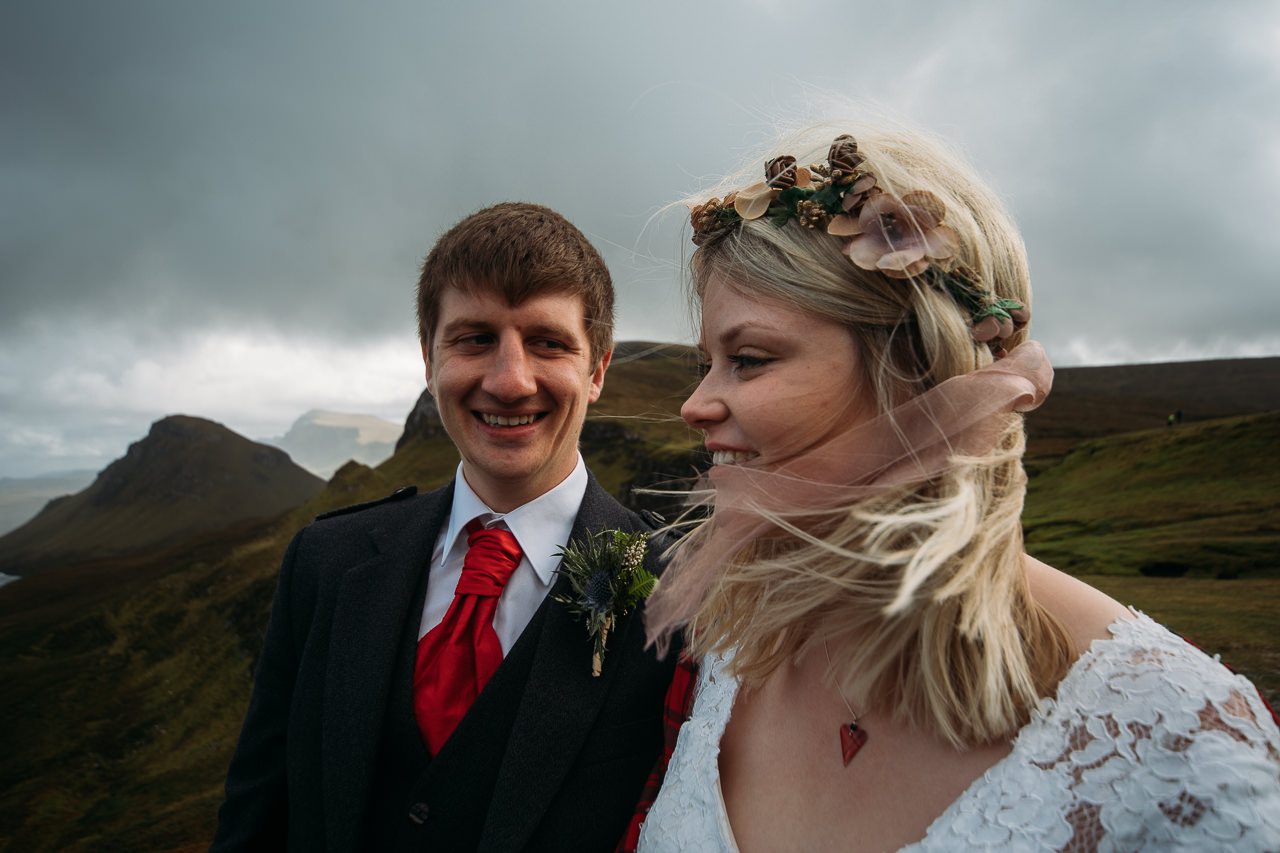 Groom and Bride with tartan shawl wedding photography at Quiriaing Isle of Skye