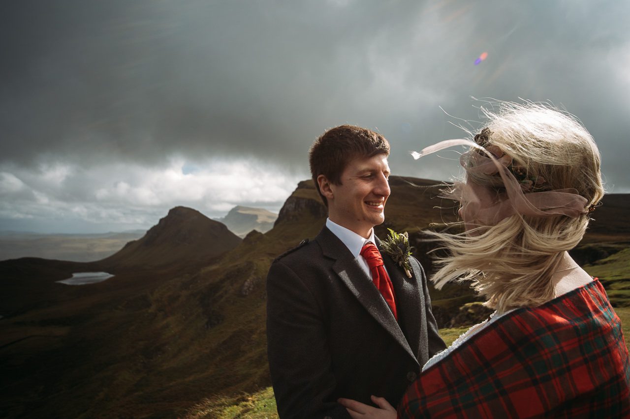 Groom and Bride with tartan shawl wedding photography at Quiriaing Isle of Skye