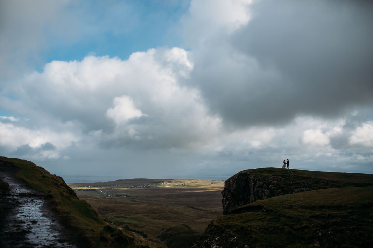 Couple on wedding day at Quiraing Isle of Skye tiny in landscape
