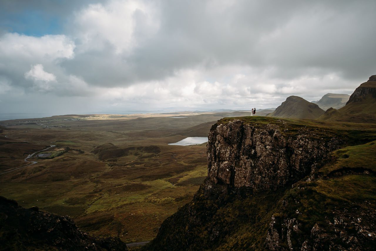 Couple on wedding day at Quiraing Isle of Skye tiny in landscape