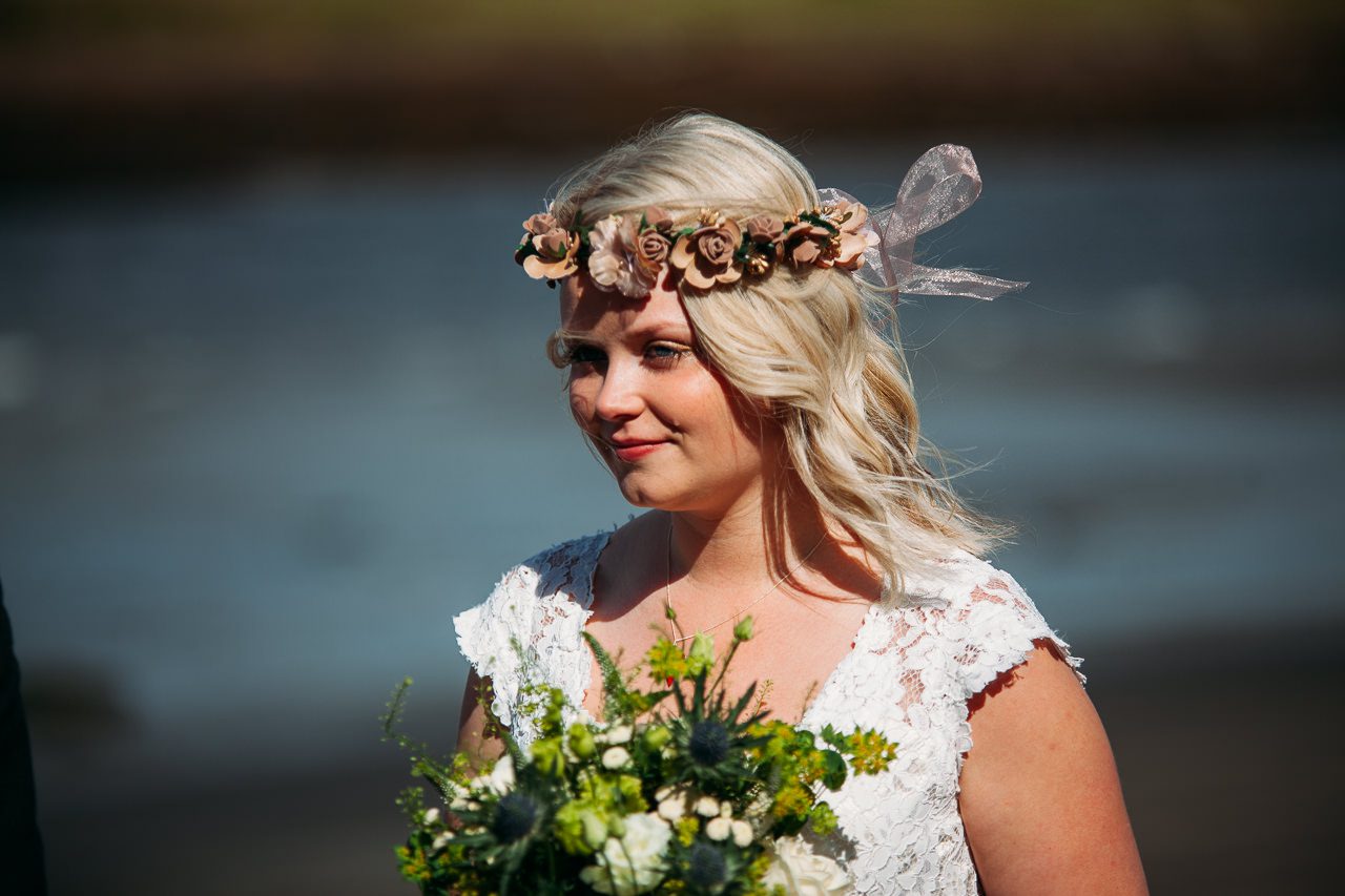 Blonde bride with floral crown Isle of Skye by sea