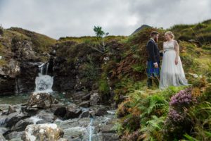 Bride and groom by waterfalls Glenbrittle Isle of Skye