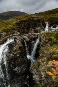 Bride and groom by waterfalls Glenbrittle Isle of Skye