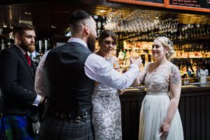 Wedding party toast in Seumas bar Slighachan Isle of Skye