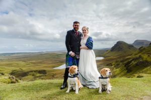 Groom and best man smoke cigars Sligachan Isle of Skye