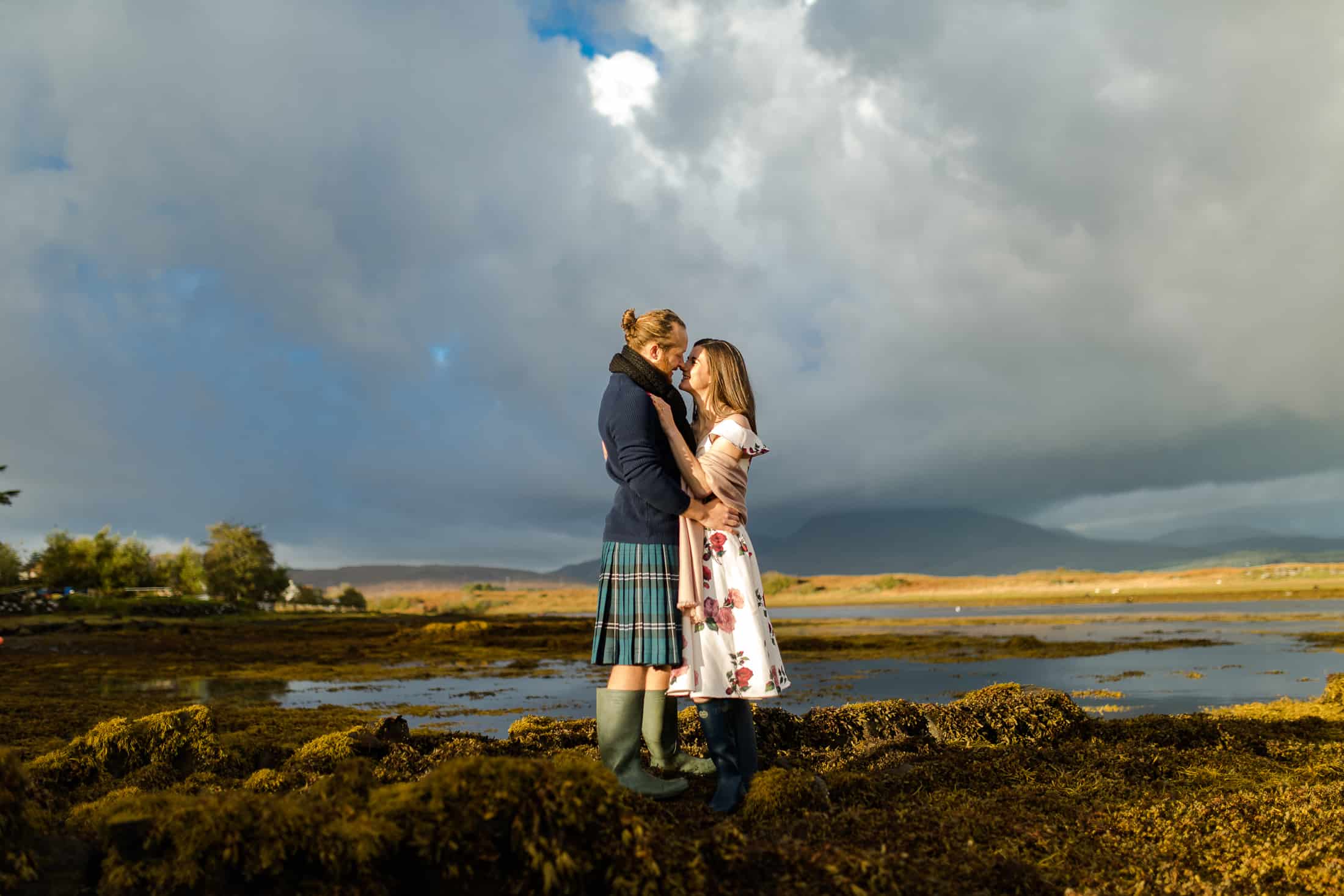 Engagement photoshoot on beach with mountains Isle of skye