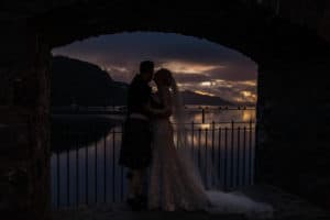 Bride and groom sunset Eilean Donan Castle