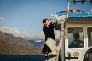 deckhand adjusts bunting Isle of skye boat elopement