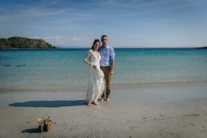 wedding couple with sand beach and turquoise sea Isle of skye