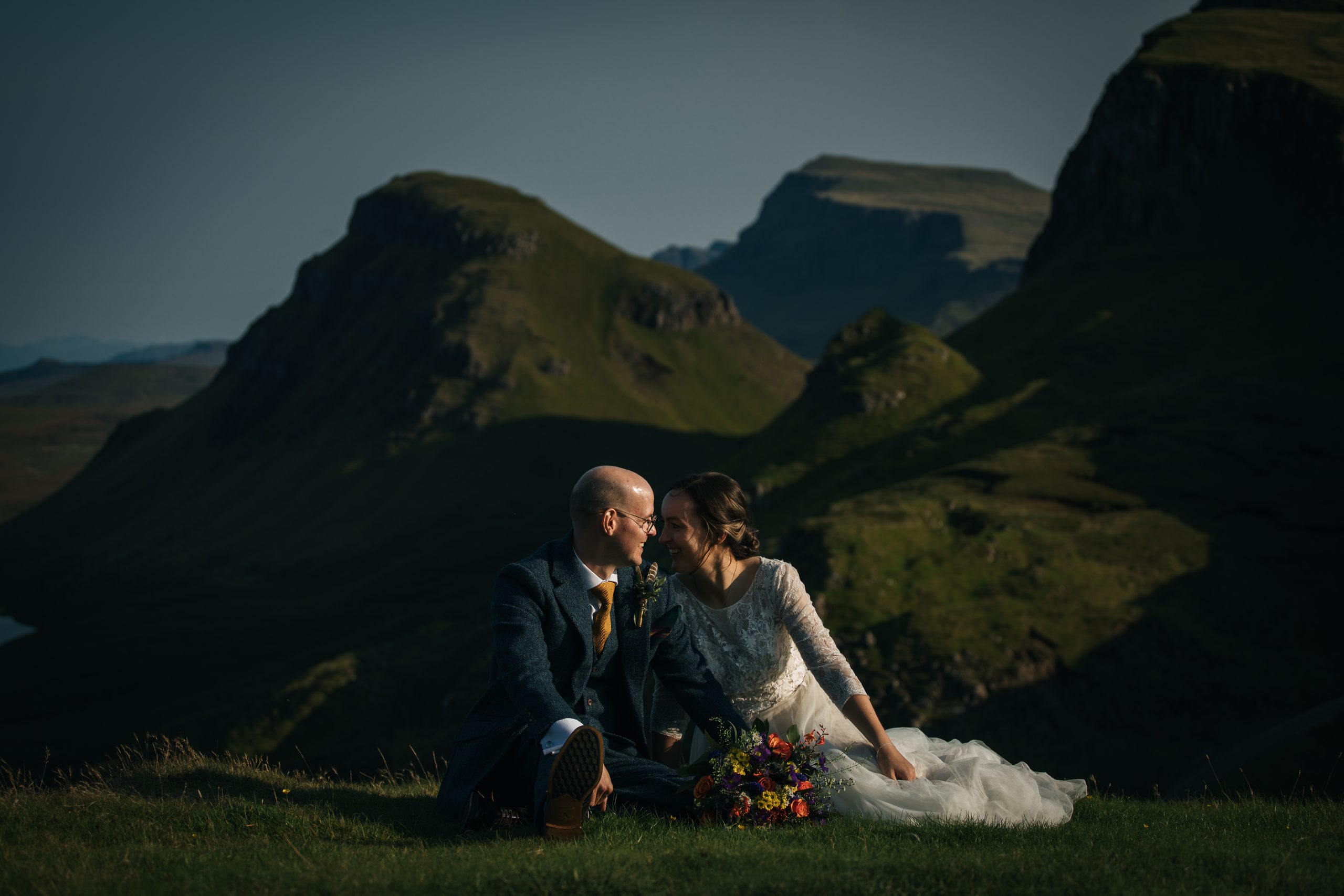 Bride and Groom at Quiraing, Isle of Skye in summer. Green hills