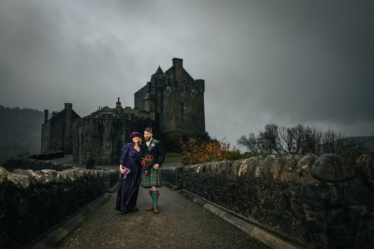 Eilean Donan Castle wedding. Purple dress and kilted groom