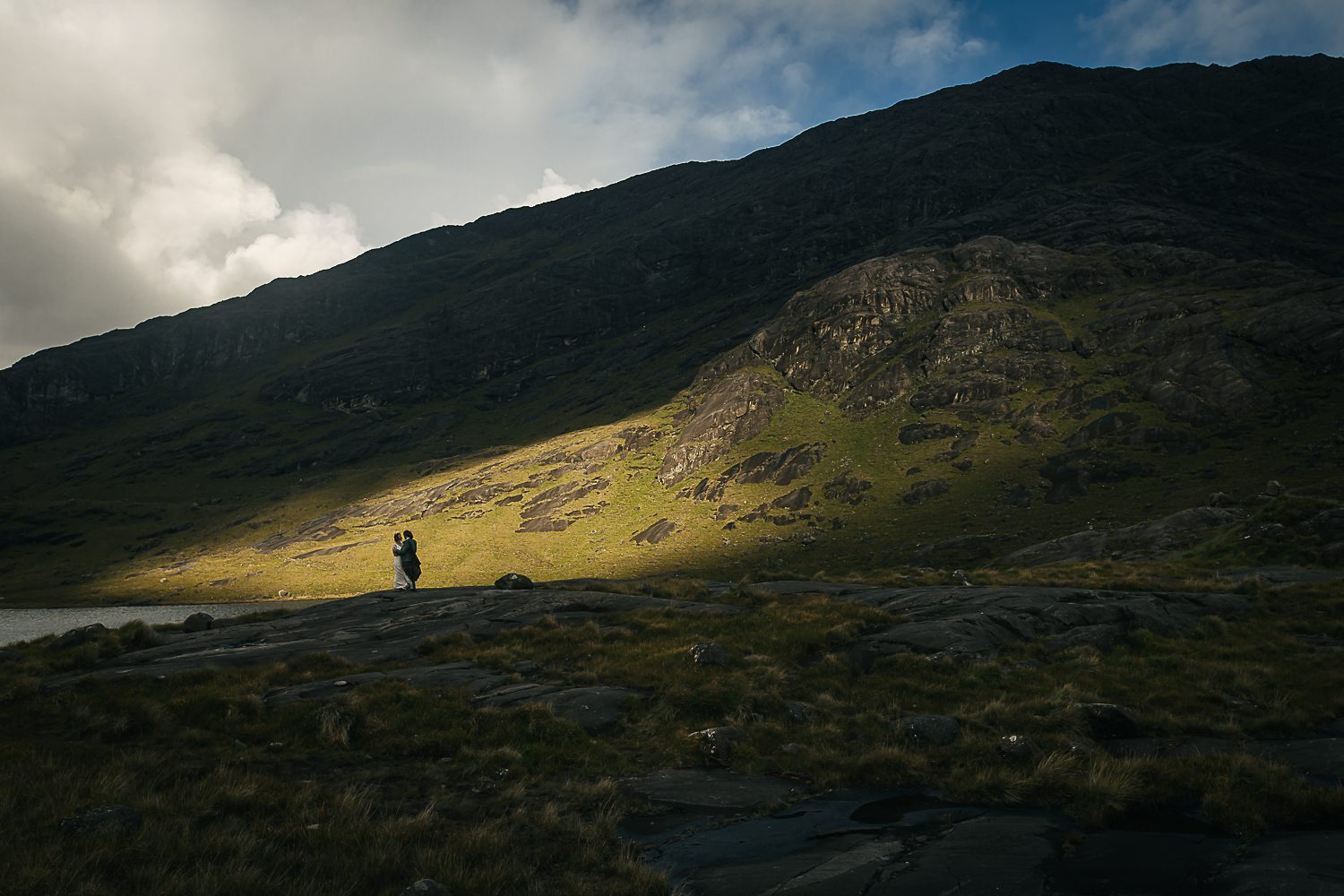 bride and groom caught in dramatic light Loch Coruisk, Isle of Skye