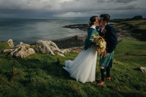 Elopement couple kiss at Brothers Point Isle of Skye